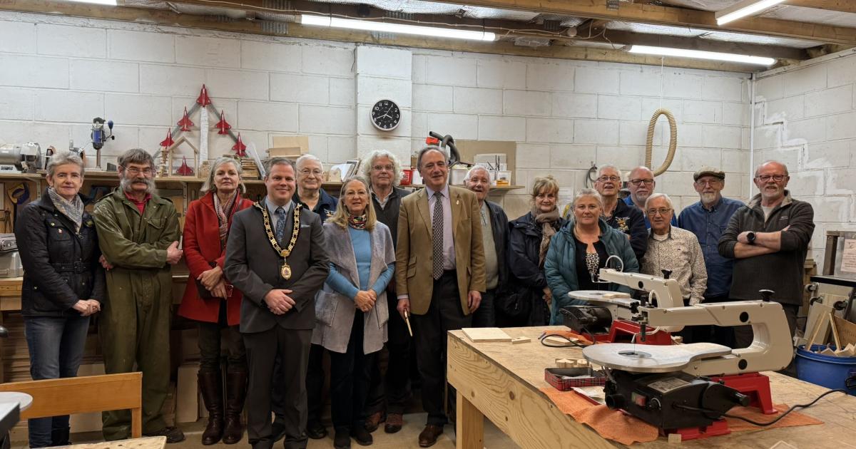 Calne Men’s Shed members with the High Sheriff of Wiltshire in the workshop